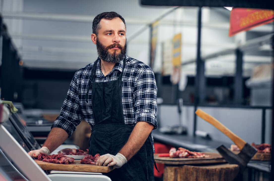 Our Heritage butcher-looking-off-camera